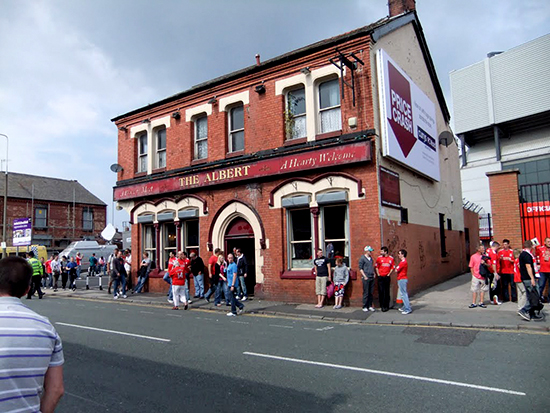 The Kop, den legendariske ståtribunen bak det ene målet på Anfield, anses som en av de viktigste tribunene for utviklingen av supporterkulturen i fotballen – både i verbale så vel som visuelle utrykksformer. Det var her tribuneallsangen skal ha startet. The Kop ble også en catwalk for supportermoten. Under flomlysbelagte europacupkamper het det at The Kop kunne «suge ballen inn i mål».
